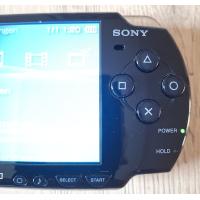 PSP 2004 zwart Complete Set  in nieuwstaat + autolader